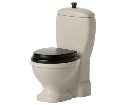 WC in Off White mit schwarzem Sitz, freigestellt