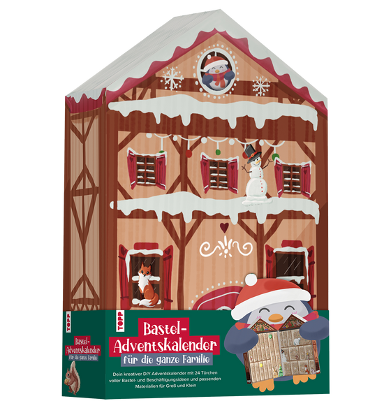 Verpackung des TOPP Bastel-Adventskalenders in Form eines Fachwerkhauses mit Pinguin